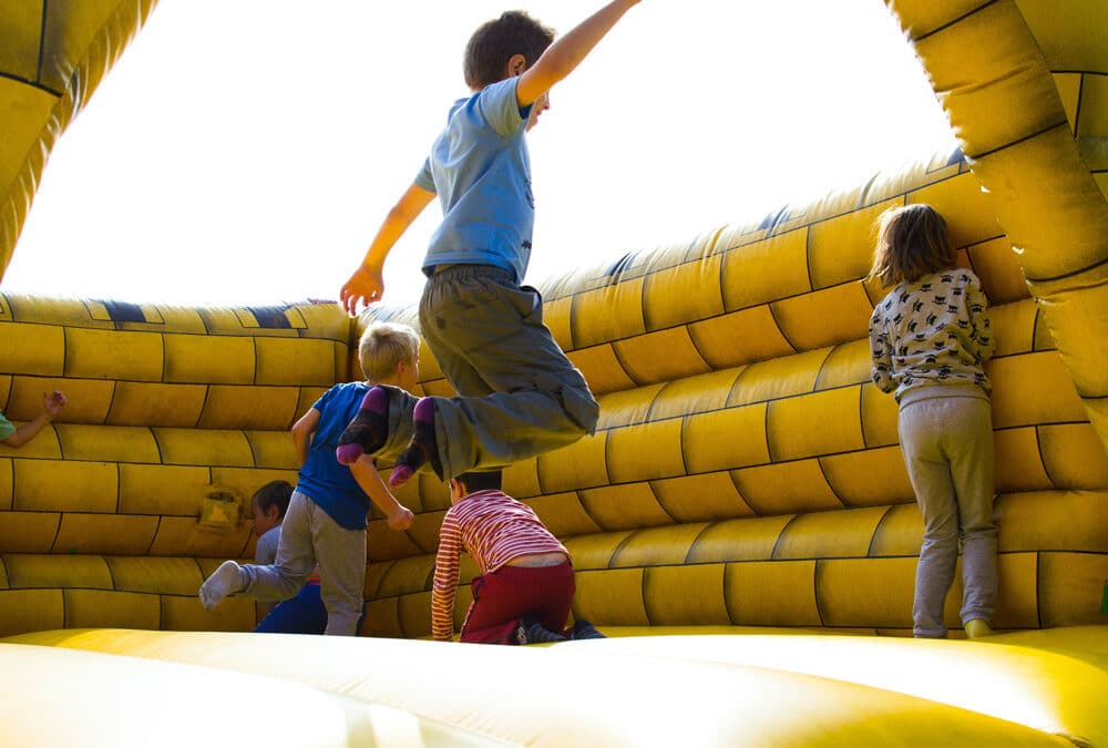Kids Are Jumping On Inflatable Castle