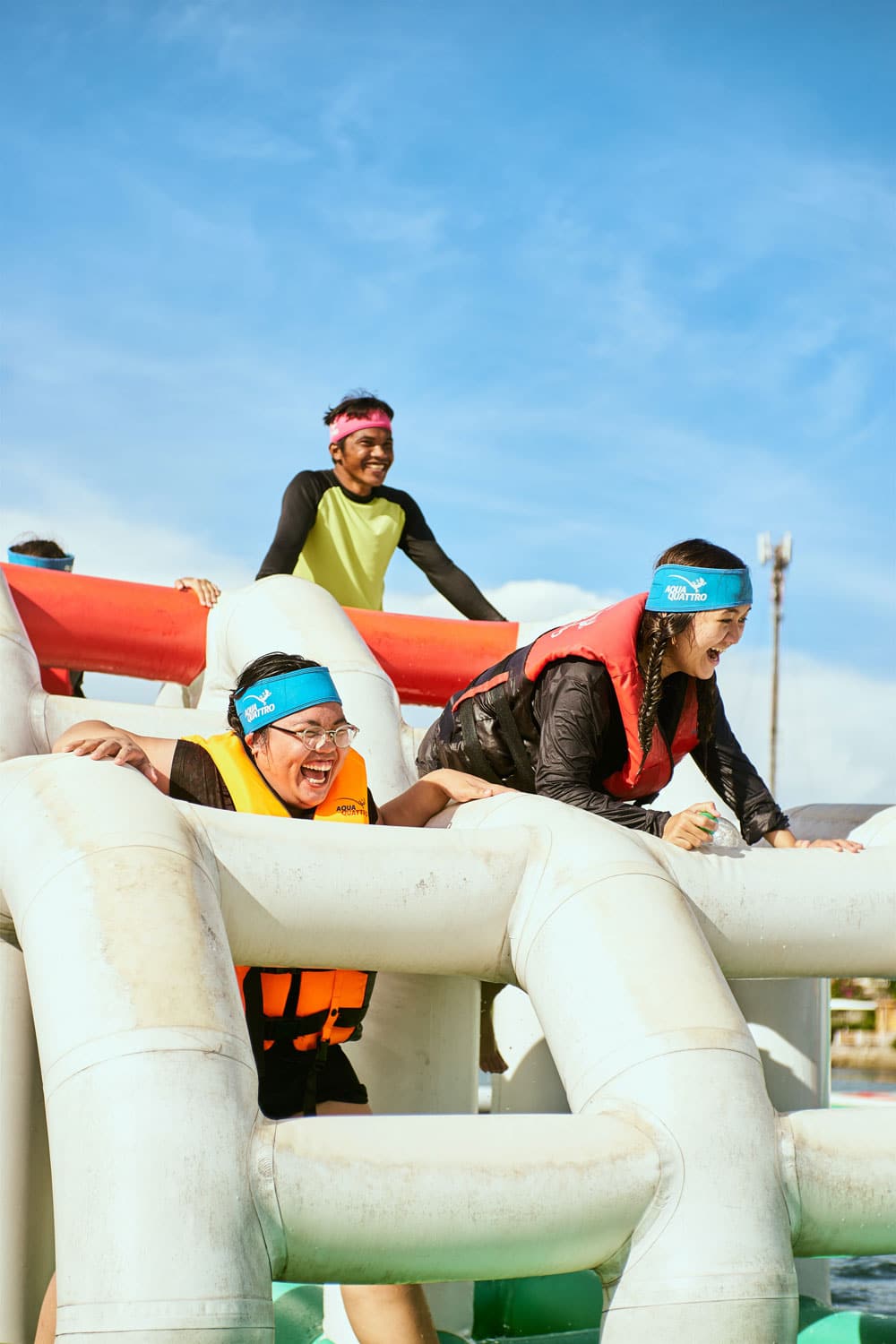 Adults Having Fun On White Inflatable